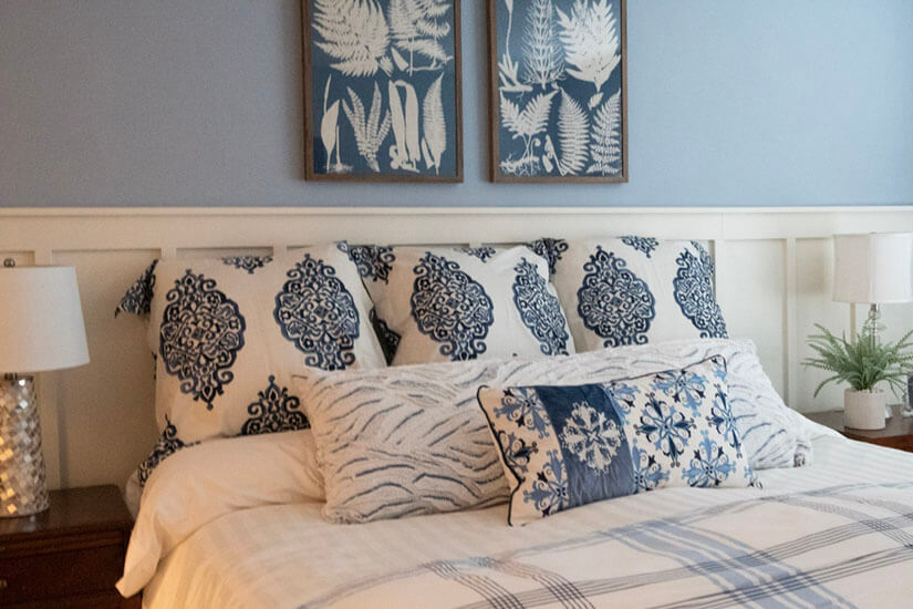 Blue bedroom with accent pillows